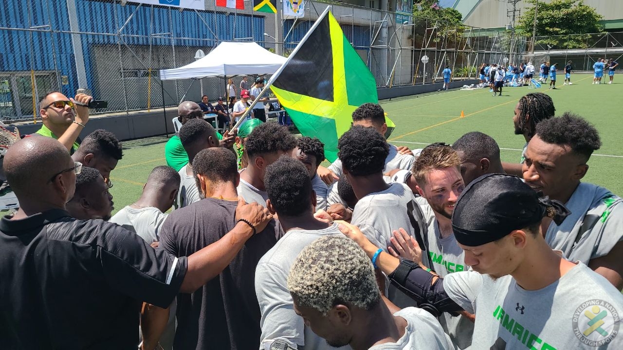 Jamaica's Lacrosse Team Huddles after Qualifying